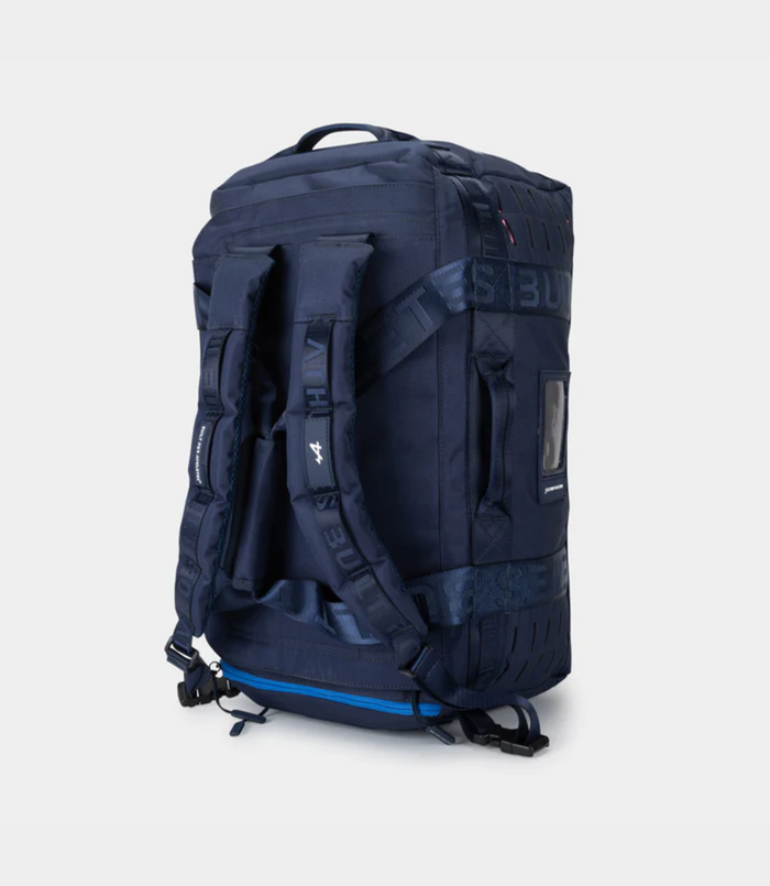 Navy duffel shown with adjustable padded backpack straps and top grab handle