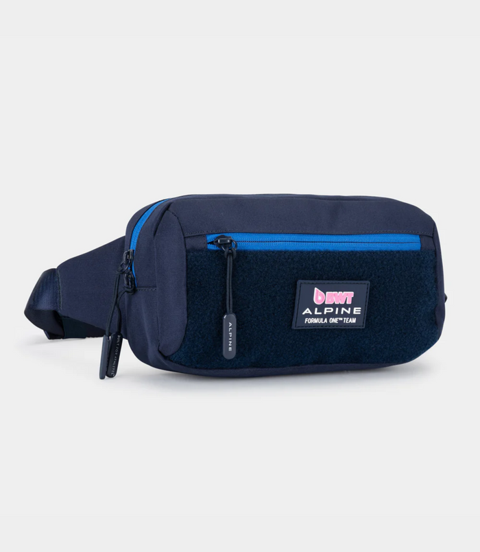 Close up of navy Built for Athletes crossbody bag showing the blue zip pocket and Alpine logo