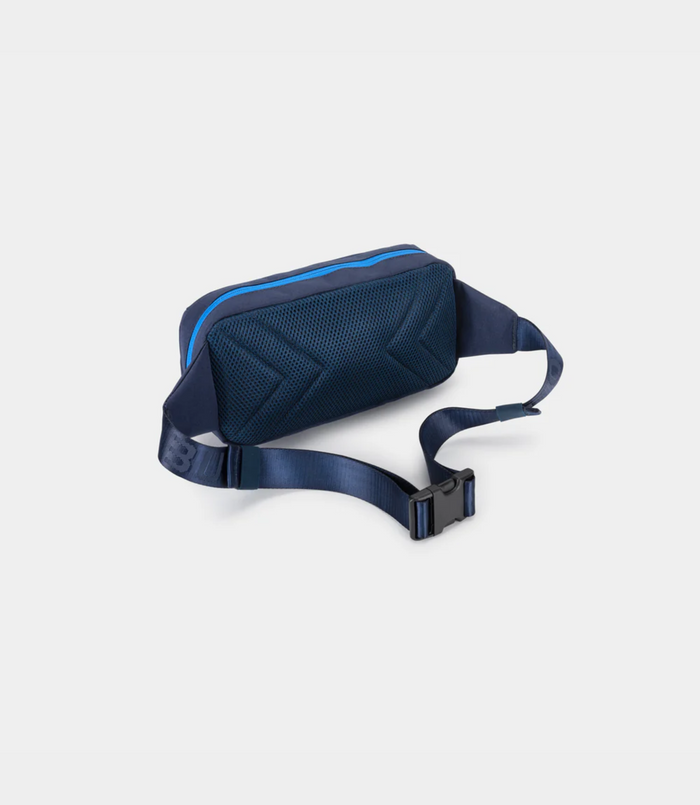 Open main compartment of navy Built for Athletes crossbody bag showing blue trim and interior mesh pocket