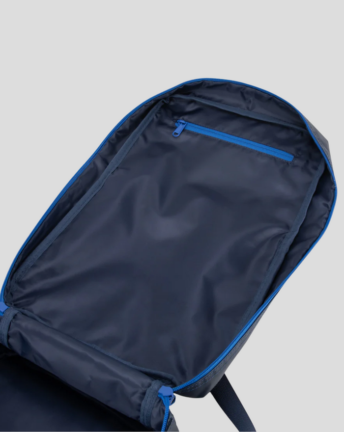 Inside view of the TYRO 20L backpack with a blue zip pocket and roomy main compartment