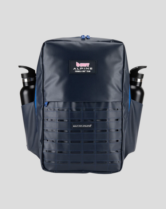 Navy TYRO 20L backpack with two water bottles in side pockets and grid front panel