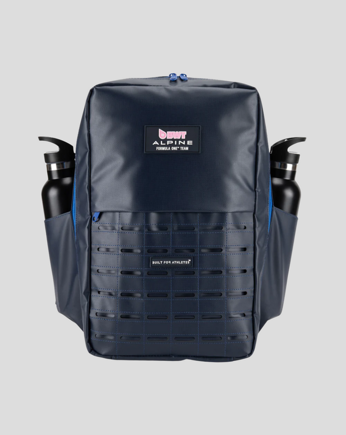 Navy TYRO 20L backpack with two water bottles in side pockets and grid front panel