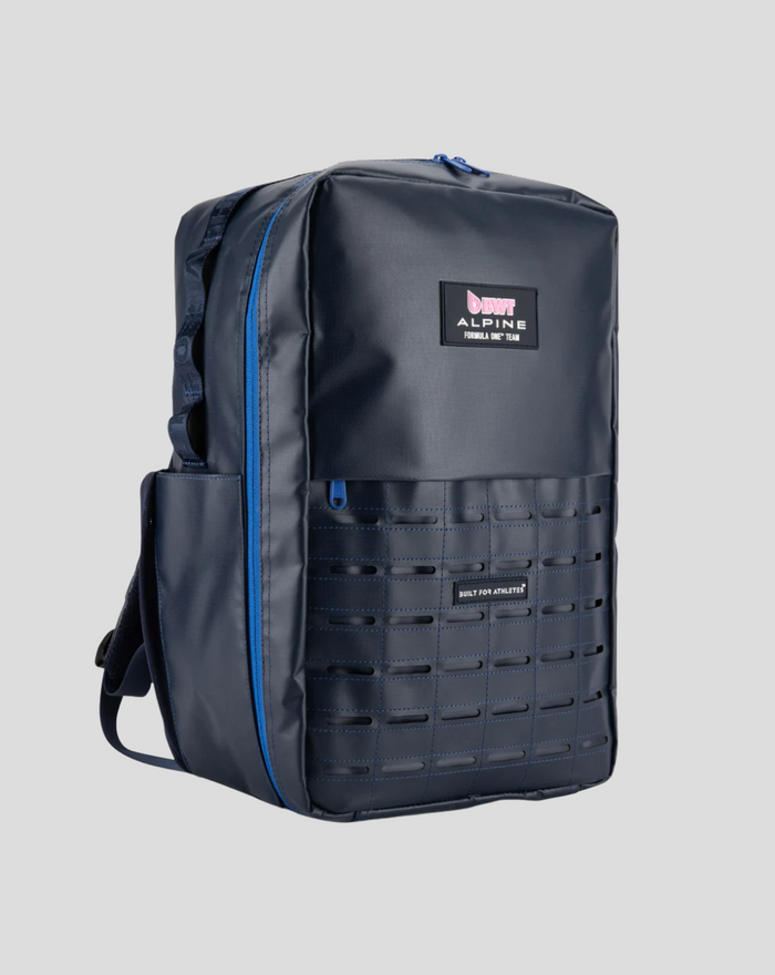 TYRO 20L backpack shown from a side angle with blue zipper and grid panel on the front.