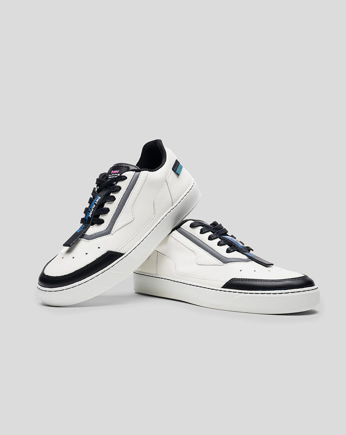 Pair of white and black Endstate sneakers with blue detailing shown together on a gray background