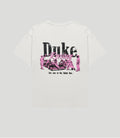 Back view of white vintage style T shirt with large black Duke text and pink Racing script graphic depicting a racing scene