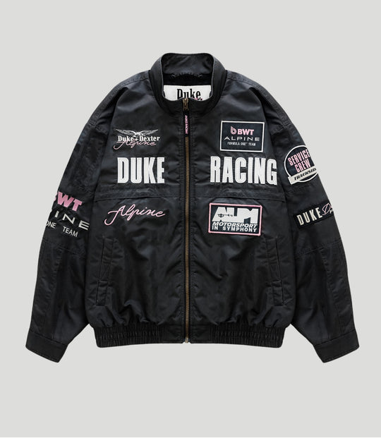 Front view of black BWT Alpine trackside jacket with patches and zipper