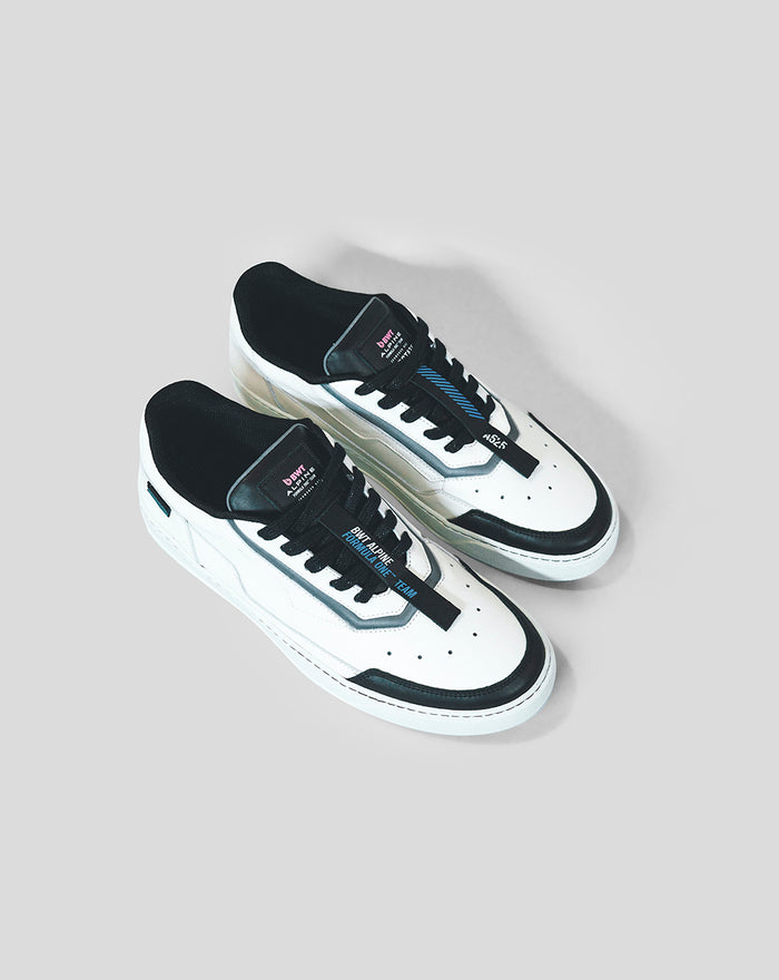 Overhead view of white and black BWT Alpine Endstate sneaker with blue accents and tongue tag