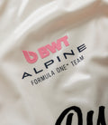 Cream fabric close up with pink BWT Alpine logo