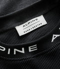 White Duke & Dexter label stitched to black waffle jersey