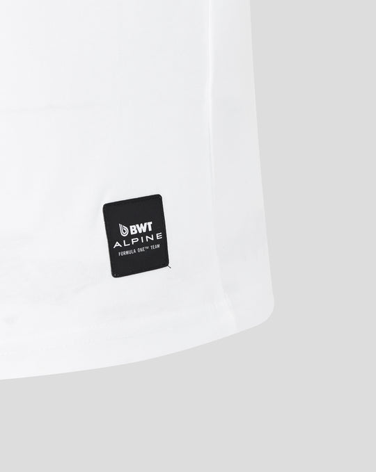 Hem area of white T shirt showing a black BWT Alpine patch with Formula One Team branding