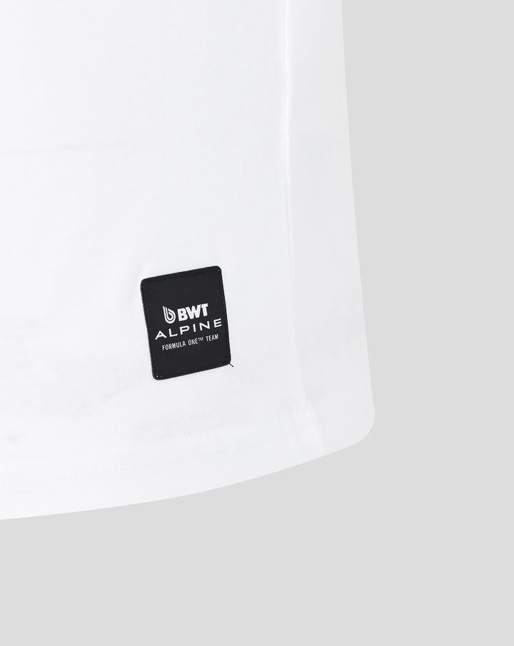 Hem area of white T shirt showing a black BWT Alpine patch with Formula One Team branding