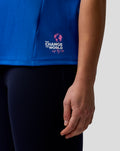 Side view of blue Set Up T Shirt with Change the World logo at the hem