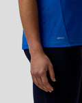 Blue Official Women's BWT Alpine Formula One Team Polo Shirt close-up at the hem showing the AerTek label.