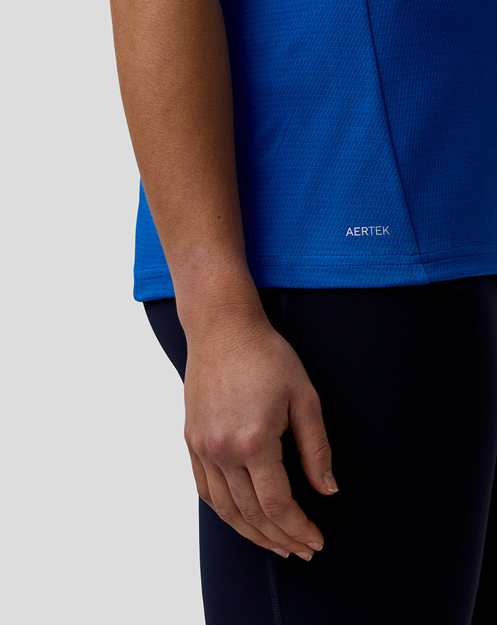 Blue Official Women's BWT Alpine Formula One Team Polo Shirt close-up at the hem showing the AerTek label.
