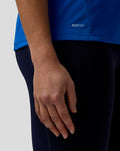 Blue BWT Alpine official women's F1 team T shirt close up highlighting AerTek wordmark at the hem