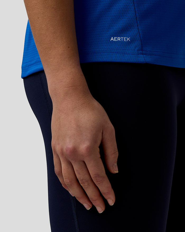 Blue BWT Alpine official women's F1 team T shirt close up highlighting AerTek wordmark at the hem