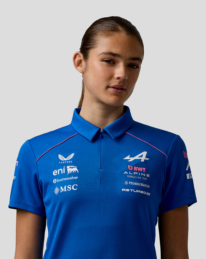 Close-up of the blue BWT Alpine polo chest area showing sponsor logos.