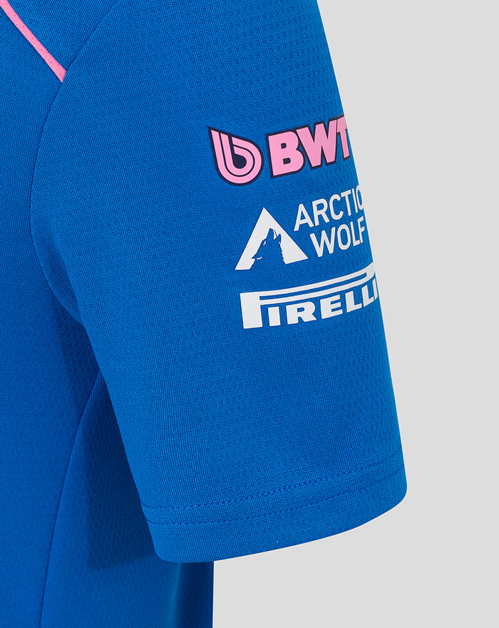 Close up of blue Official Junior Formula One polo sleeve showing pink BWT logo and Arctic Wolf and Pirelli branding.