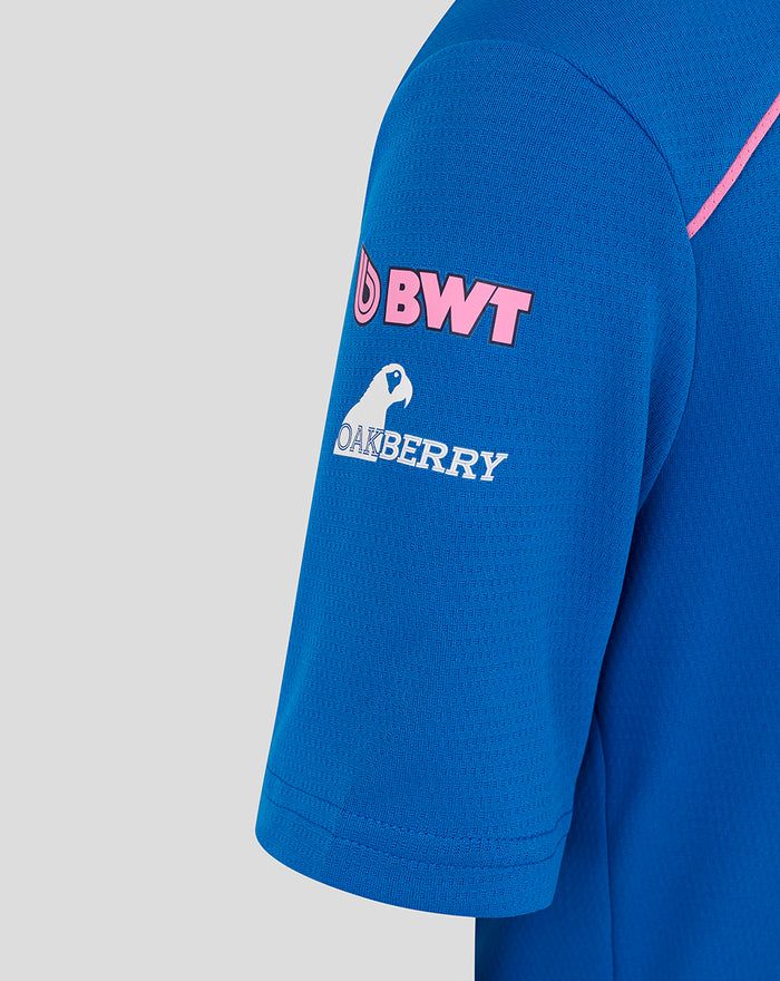 Close up of blue polo sleeve displaying BWT logo and Oakberry branding plus Change the World slogan.