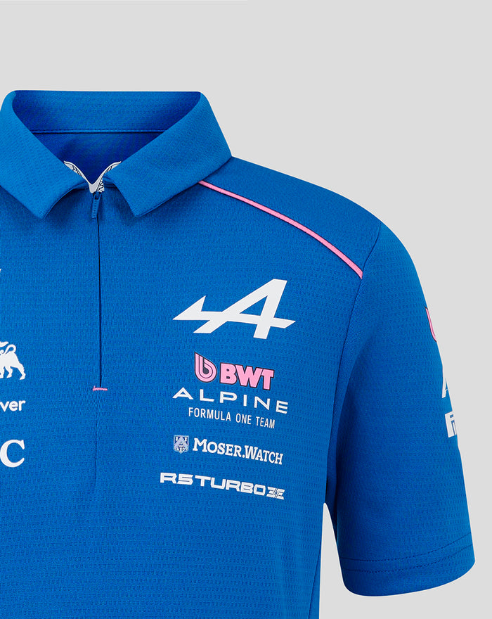 Blue BWT Alpine polo with pink shoulder piping and a large white 44 emblem on the chest along with sponsor logos