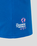 Lower sleeve close up on blue T shirt with Change the World graphic and globe icon