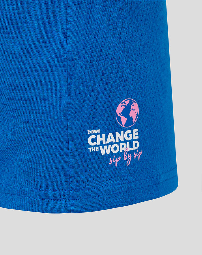 Lower sleeve close up on blue T shirt with Change the World graphic and globe icon