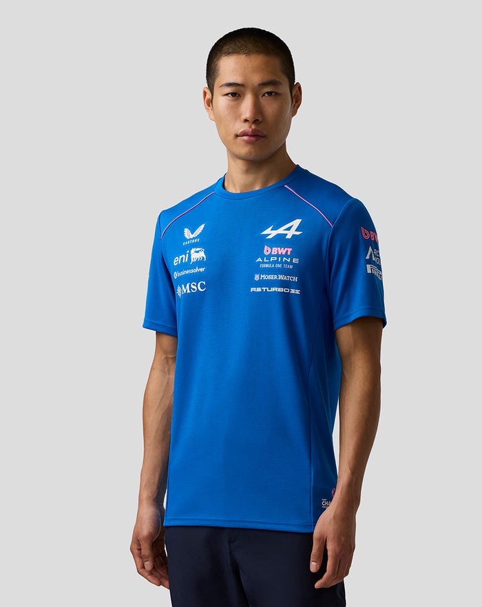 Front view of male model in blue BWT Alpine Formula One Team Set Up T Shirt with multiple sponsor logos