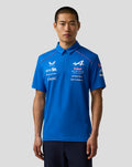 Model wearing blue Official Men’s Formula One Team polo with chest sponsor logos and a polo collar