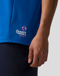 Blue T shirt close up with Change the World World Tour 2026 logo at the hem