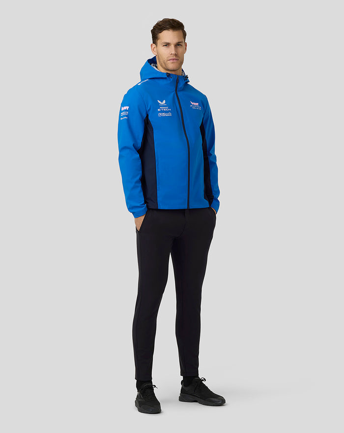 Front view of a man in a lapis blue BWT Alpine water resistant jacket with hood, full front zipper and sponsor logos on the chest