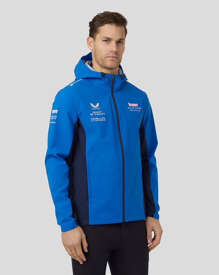 Male model in lapis blue BWT Alpine water resistant jacket with hood and front zip, showing logos.