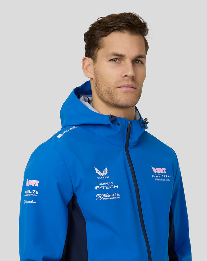 Male model wearing bright blue BWT Alpine water resistant jacket with hood and sponsor logos.