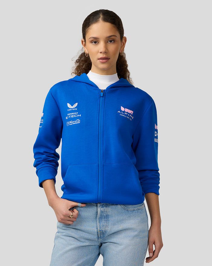 Model wearing blue BWT Alpine Formula One Team full zip hoodie with chest and sleeve logos.