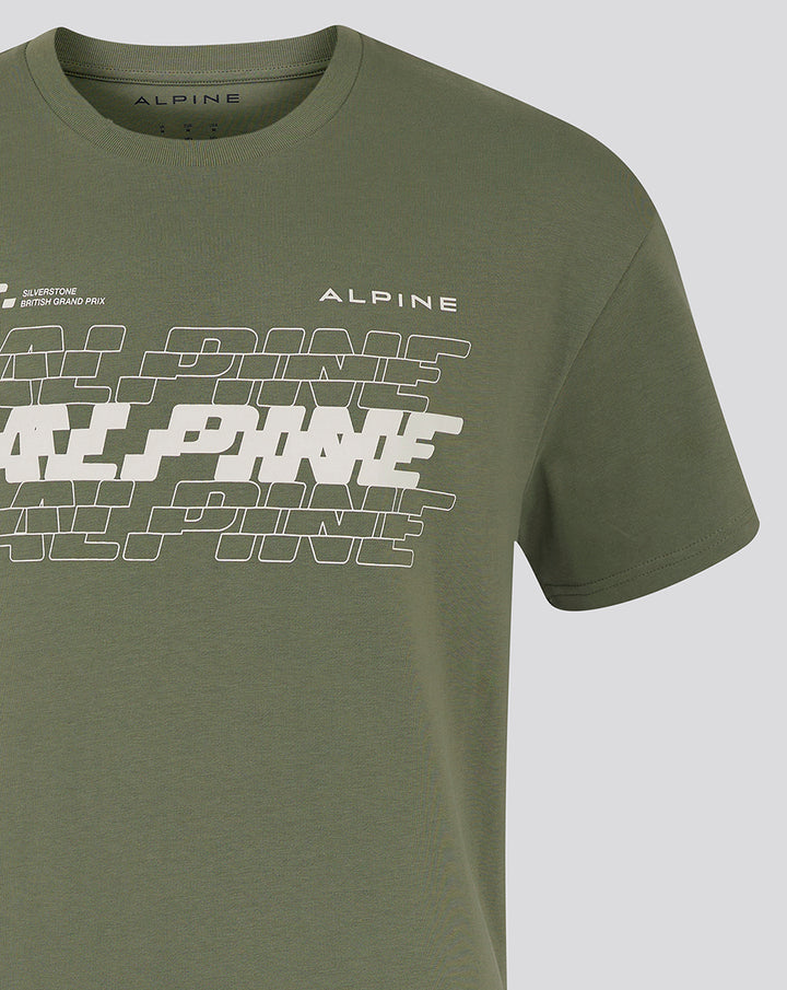 Close-up of chest area on olive green Alpine T-shirt featuring white graphic and Alpine branding