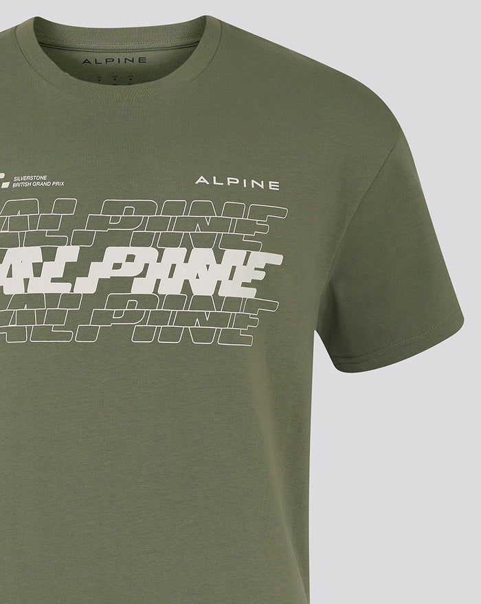 Close-up of chest area on olive green Alpine T-shirt featuring white graphic and Alpine branding