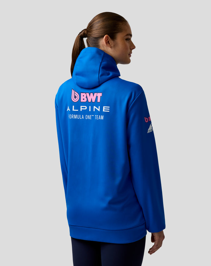 Blue BWT Alpine Formula One Team hoodie on a female model, back view with branding and sleeve logos
