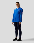 Blue BWT Alpine Formula One Team hoodie worn by a model front view with sponsor logos on chest and sleeve