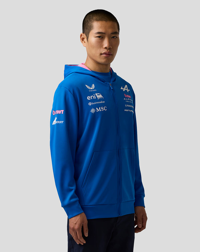 Model wearing bright blue unisex Formula One Team Zip Hoodie with front chest and sleeve branding