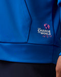 Blue unisex zip hoodie with pink globe and CHANGE THE WORLD logo on the chest