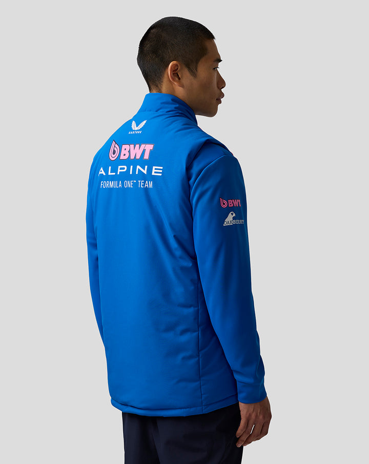Back view of a blue hooded puffer gilet with large BWT Alpine Formula One Team branding on the back