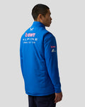 Back view of a blue hooded puffer gilet with large BWT Alpine Formula One Team branding on the back
