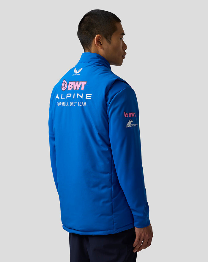 Back view of a blue hooded puffer gilet with large BWT Alpine Formula One Team branding on the back