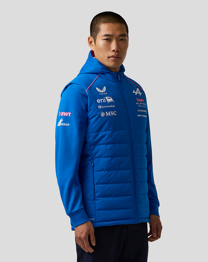 Male model in blue BWT Alpine Formula One Team hooded gilet with front zip and chest logos