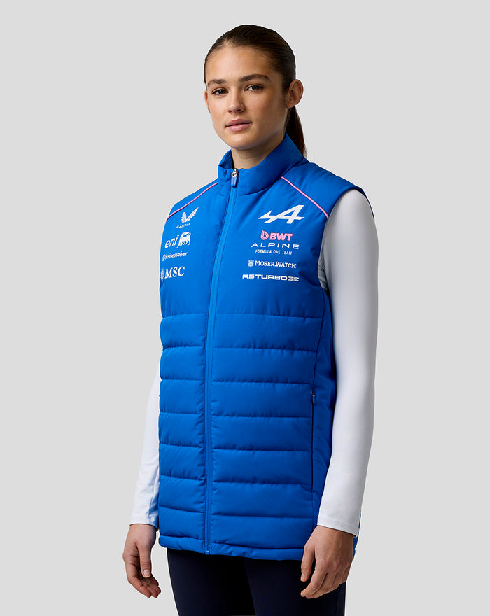Female model in blue BWT Alpine Formula One Team gilet with chest logos and a front zip