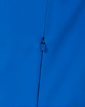 Close-up of center front blue zip with guard on the Official BWT Alpine Formula One Team Soft Shell Jacket