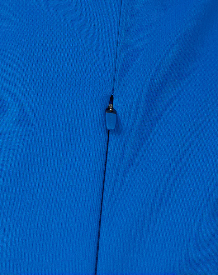 Close-up of center front blue zip with guard on the Official BWT Alpine Formula One Team Soft Shell Jacket