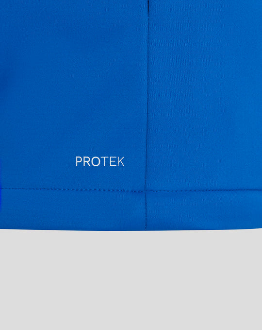 Blue ProTek jacket fabric close up with PROTEK wordmark near the hem