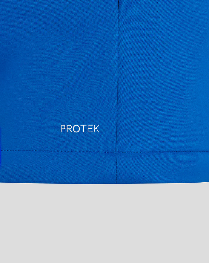 Blue ProTek jacket fabric close up with PROTEK wordmark near the hem