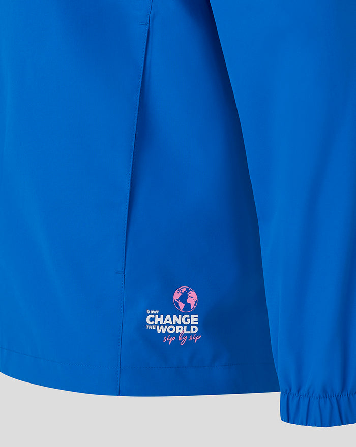 Back of blue Official Unisex Formula One Team rain jacket displaying Alpine branding across the upper back