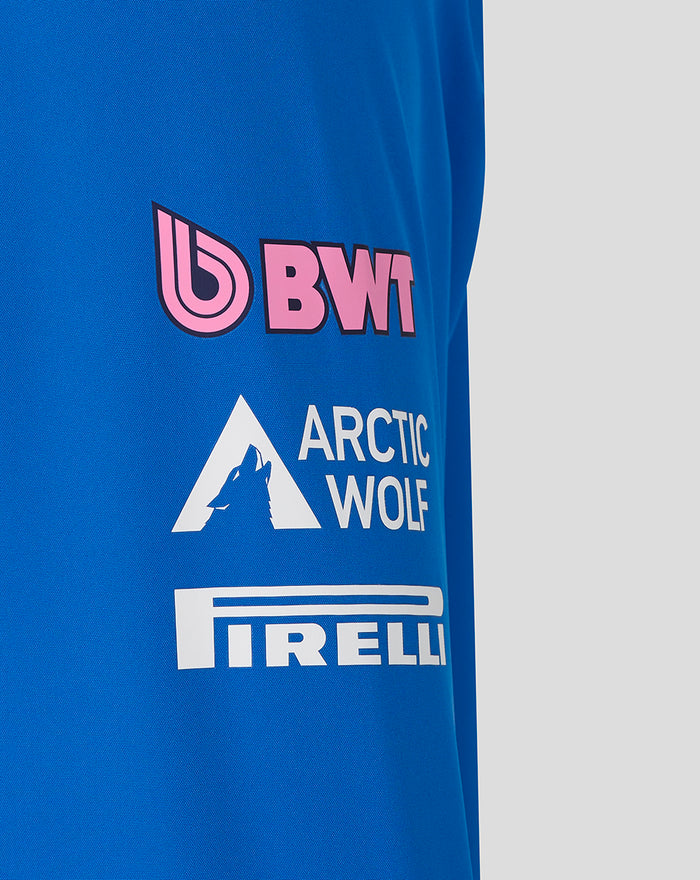 Lower back of blue rain jacket with Change the World graphic and sponsor logos